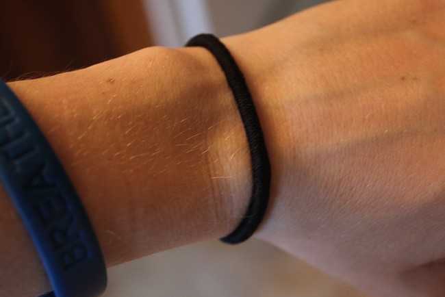 hair tie on guys wrist